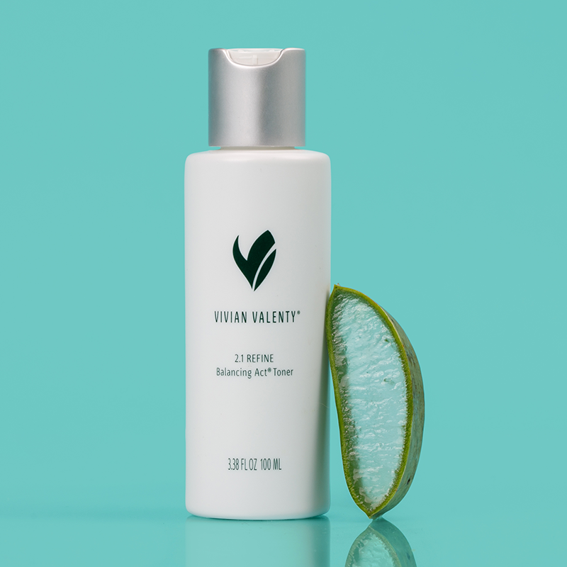 Step 2: Vivian Valenty Skincare Refine on a turquoise background with water droplets and a fresh Aloe Vera, representing clean, fresh, and healthy skin.