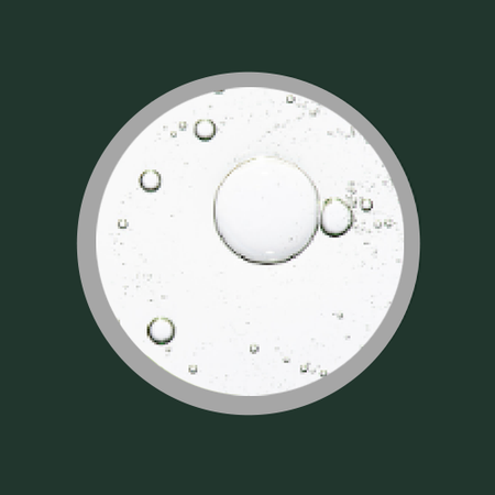 Lactic Acid swatch circle representing natural, clean, and skin-friendly ingredients.