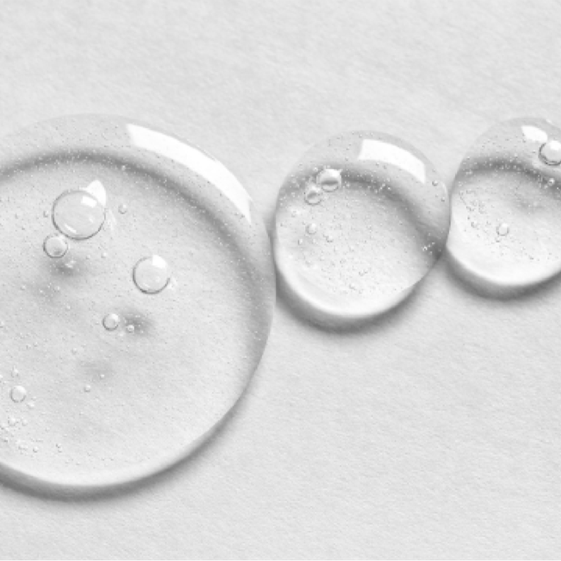 Close-up of a Protect droplet from Vivian Valenty Skincare, representing hydration and nourishment for healthy, glowing skin.