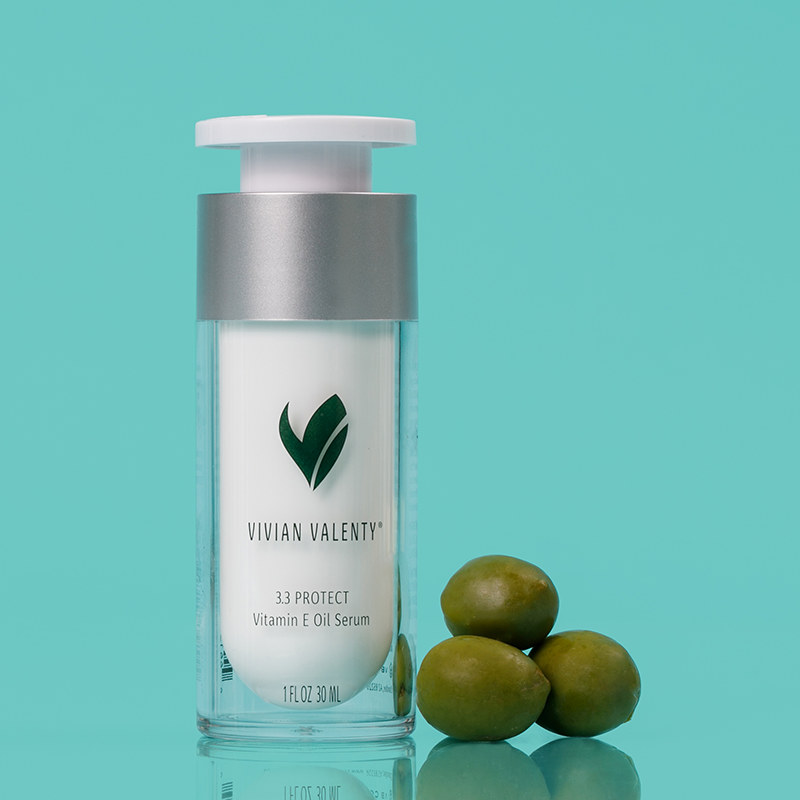 Step 3.3: Vivian Valenty Skincare Protect on a turquoise background with water droplets and a fresh apple, representing clean, fresh, and healthy skin.
